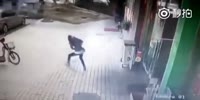 Girl is flattened by a large shop sign