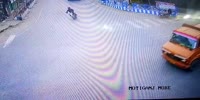 Biker slides under the truck in a slow mo