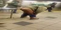 A homeless woman urinating on train platforms