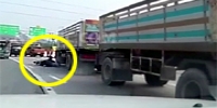Thai Girl Falls Under Truck