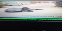 Man falls and slides under vehicle