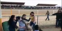 Girls fight at the horse race