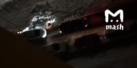 Girls gets crushed against another car while an argue with a driver over a parking lot