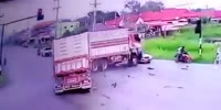 Truck loses control nearly killing riders at the intersection