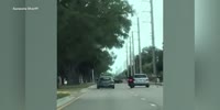 Car hits biker after confrontation