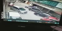 Worker with a car is hit and dragged by car