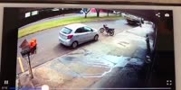 Man rolls in pain after falling off a scooter
