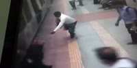 Woman slips and gets dragged by a train but saved by good man