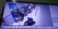 Robber shoots a guard after beating him with a pistol