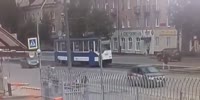 Girl in a hurry runs across the street and is thrown in the air