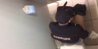 Russian cop caught wanking in WC