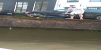 Drunk dutch dude falls into the river trying to save his beer