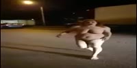 Naked drugged woman makes a show for the drivers