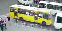 Pedestrians Sandwiched Between Buses