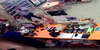 Naked girl buys a drink and condoms at the gas station store