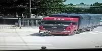 Cyclist falls under the red truck