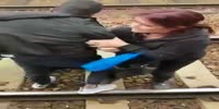 Guy pushes black on tracks but loses the fight