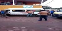 Fat shirtless taxi van drivers fight over route