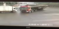 Gravel truck buries car occupants alive