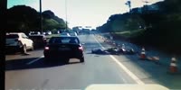 Biker wrecks into the car and barely avoids being run over