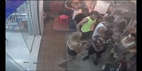 Tourists fight a local store employees