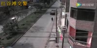 A reversing out-of-control truck hits the lone pedestrian, crushing her against a building