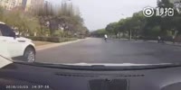 Chinese man on a bike never sees the car about to kill him