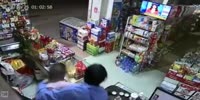 Store Owner Manhandles Armed Robber