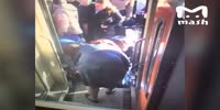 Old lady falls and stuck between the train and platform