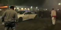 Drifting car hits spectator