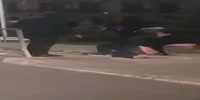 Two guys get multiple kicks in the face on the roadside