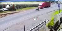 Poor bastard gets run over by the red trailer truck