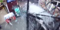Reversing SUV wrecks into the store injuring customer