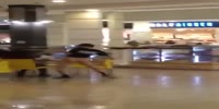 Assnaked moron walks in a busy mall