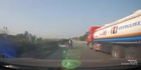 Wrong lane rider gets knocked by dashcam car