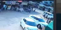 Passenger on a Motorbike falls beneath the wheels
