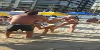 Woman loses bikini during beach fight