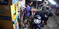 Asian punks terrorize a roadside stand.