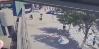 Argentina cop gets knocked by suddenly fallen wall