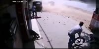 Woman rolls in despair watching ejected accident victim