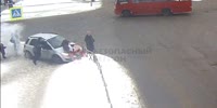 Sliding car hits an old couple at crosswalk