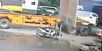 Biker falls under the truck & gets run over