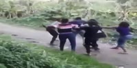 Five women beat a man in the jungle