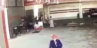 Distracted arab falls into manhole