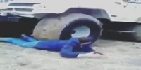Drunk Russian lets a truck roll over him on a dare