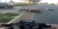 Biker slams into the turning car and passes out