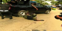 Nigerian cop falls under own vehicle