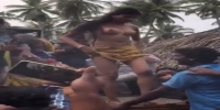 Topless girl(?) dances in front of horny men