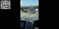 Man in Wheelchair on Highway