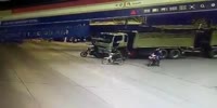 Lucky rider narrowly avoids being crushed by truck